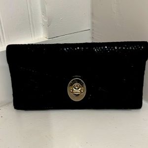 Pre-owned Black Coach wallet w/ blue leather inside. Leather & Fabric outside.